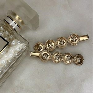 Set of two Versace Alligator Hair Clips
